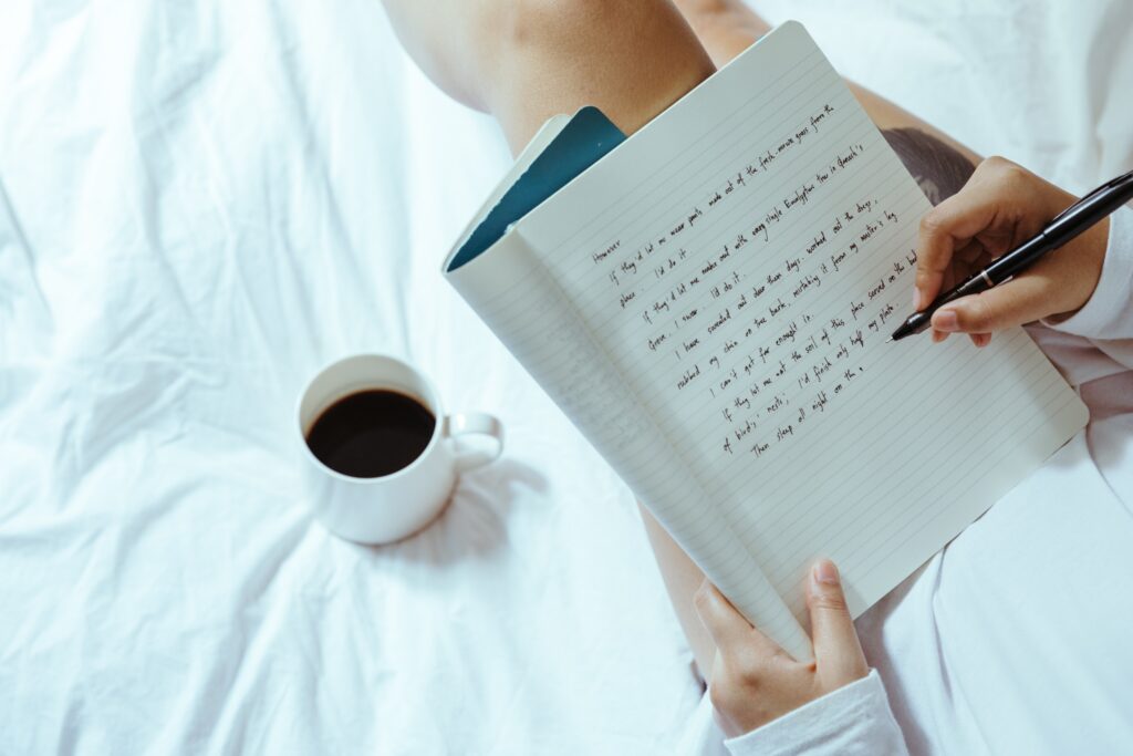 Woman writing in a journal planning to settle in Canada